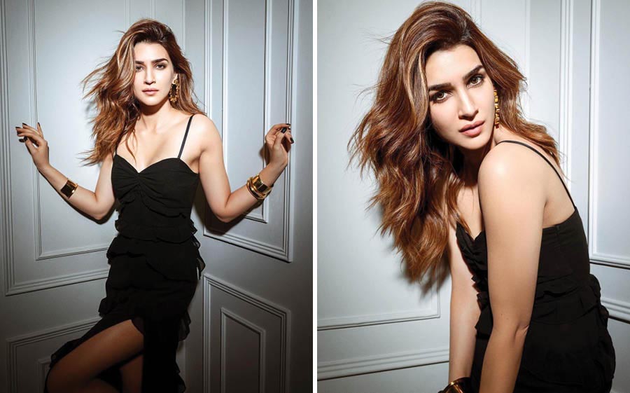 A black bodycon ruffle dress accessorised with golden hoops and bangles looked perfect with Kriti’s auburn hair. 