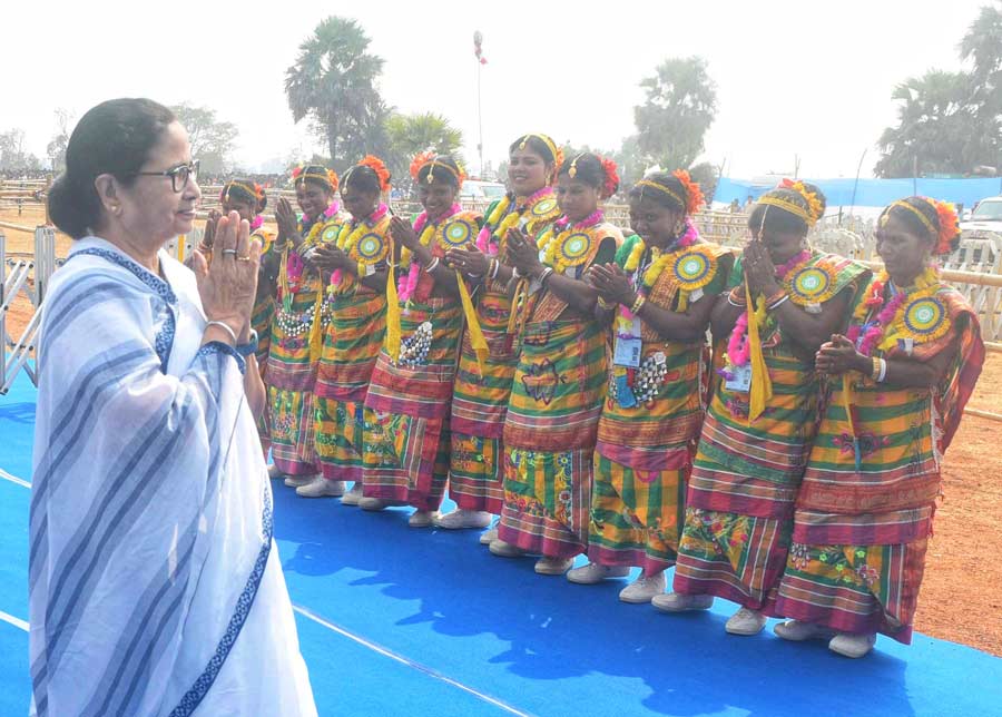 Chief minister Mamata Banerjee interacts with dancers at a public distribution programme in Bankura on Friday February 17. Banerjee is on a tour of three districts, including West Midnapore and Purulia
