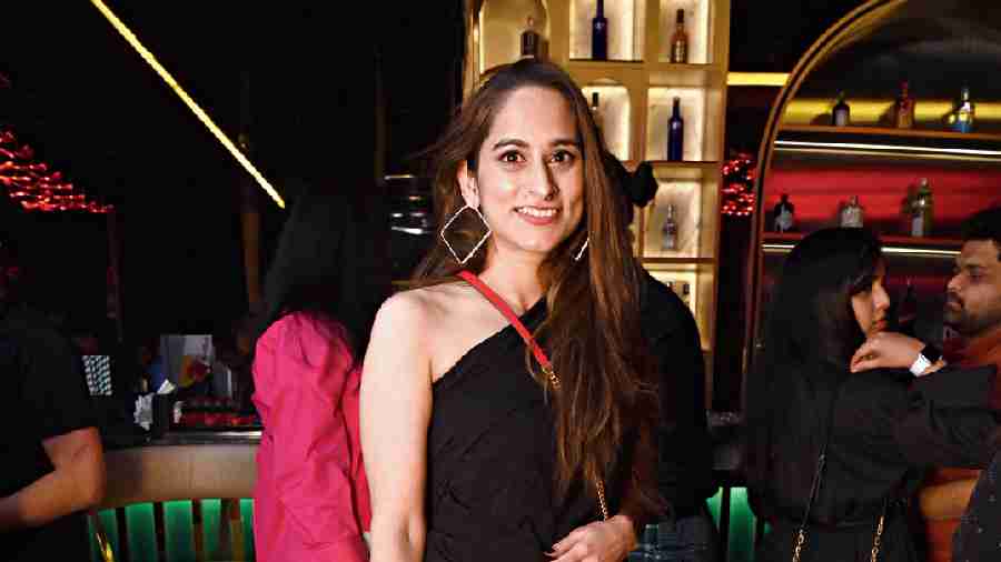 Anshika Prakash who loved the chill vibe and the music at the new hangout spot, struck a pose in her chic one-shoulder black top and white pants.