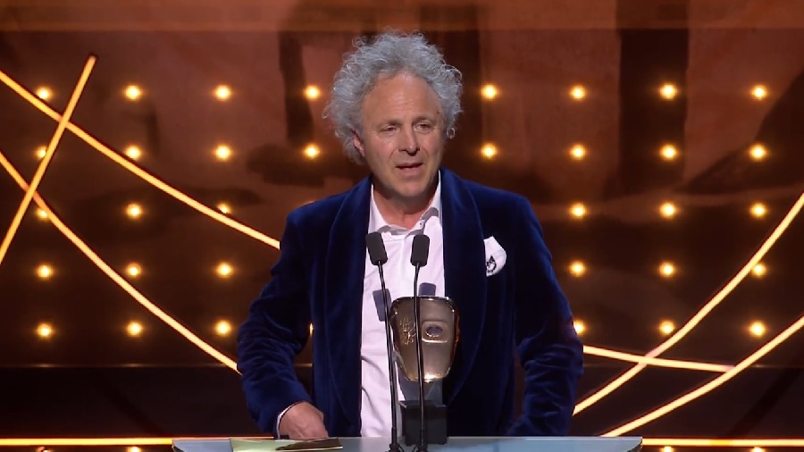 Charlie Mackesy on stage to take the Best British Short Animation award at the BAFTA 2023 for 'The Boy, the Mole, the Fox, and the Horse'. 