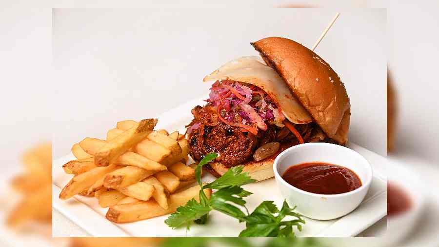 I Like Butts is the ultimate fatty and flavourful pulled pork burger, served with ketchup and fries.