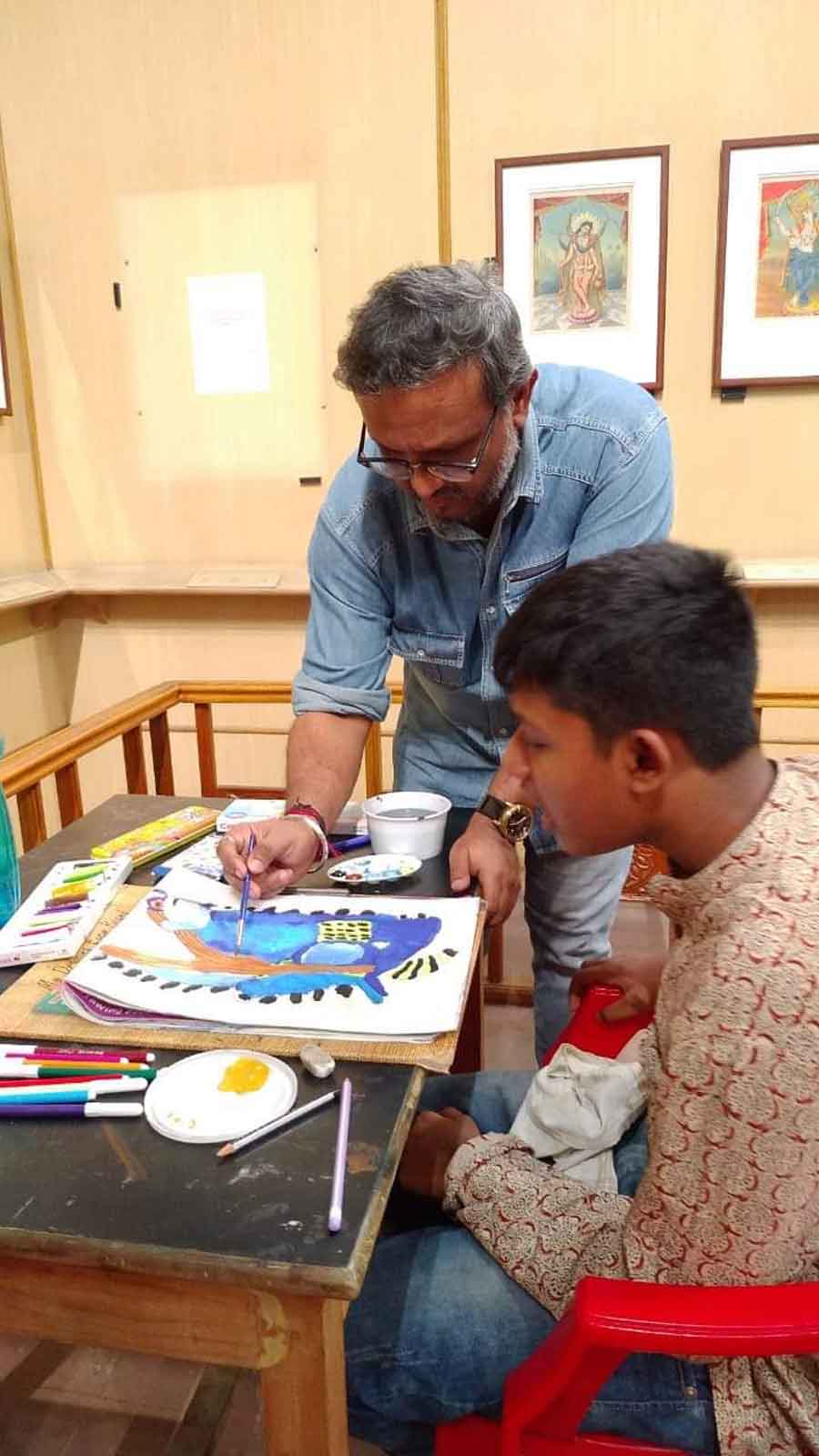 A boy tries his hand at painting at the Soulful Silence workshop organised at the Indian Museum, Kolkata. Every Monday, the Textile and Decorative Art Gallery and the Painting Gallery open their doors for children with special needs and give them a scope to engage in a variety of workshops conducted by experts of the art section of the galleries