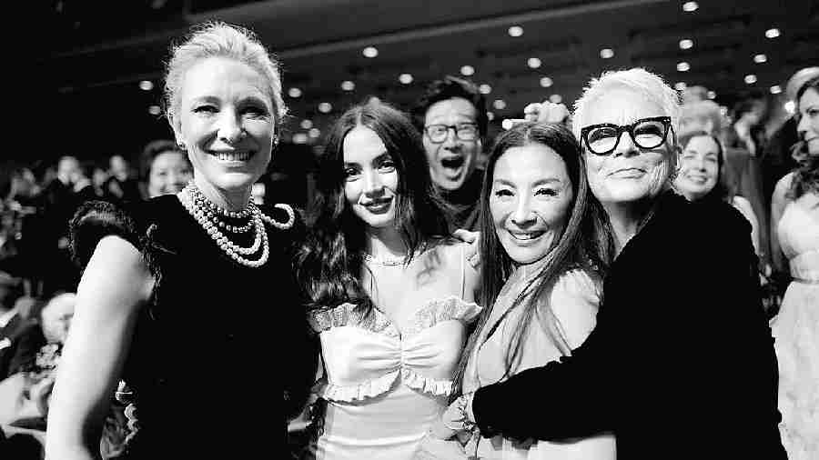 Among the numerous off-stage moments, this capture of Cate Blanchett, Ana de Armas, Michelle Yeoh and Jamie Lee Curtis (shot by Greg Williams), with Ke Huy Quan photobombing the ladies is one for the album
