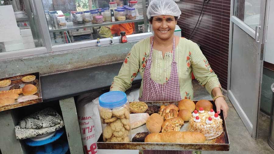 An employee of Crust & Core with some of their offerings. ‘[Crust & Core] came into existence in 2018 — the only Kolkata café that trains and employs the psychosocially disabled,’ said Sarbani Das Roy, co-founder and secretary, Iswar Sankalpa
