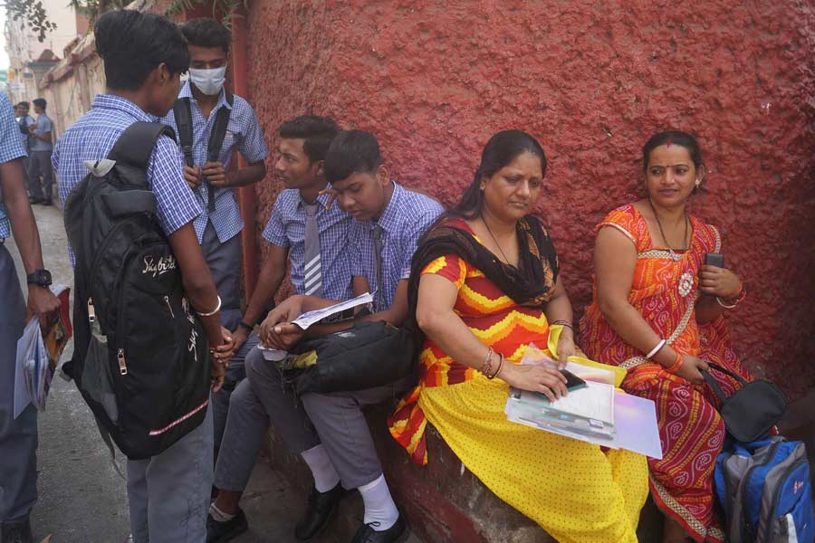 Students go through their study material one final time before entering examination halls in front of The Scottish Church Collegiate School. Parents wait for their children to step inside the exam centre. Examinees have been requested to reach their assigned test venues well ahead of time to avoid any hassle. For the smooth conduct of Madhyamik exams throughout the state, the school education department has opened a state-level control room in the directorate of school education in Bikash Bhavan 