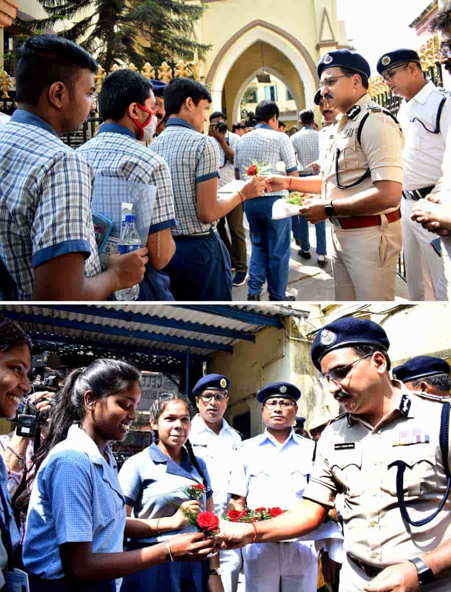 Police commissioner Vinit Kumar Goyal hands over flowers to students appearing for Madhyamik exam at Cathedral Mission High School, south Kolkata, on Thursday