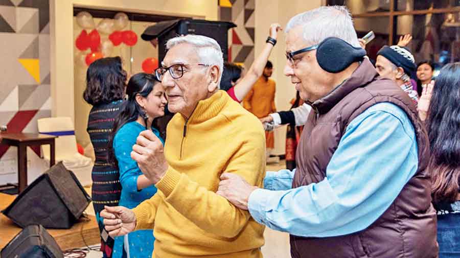 An elderly resident jives with support