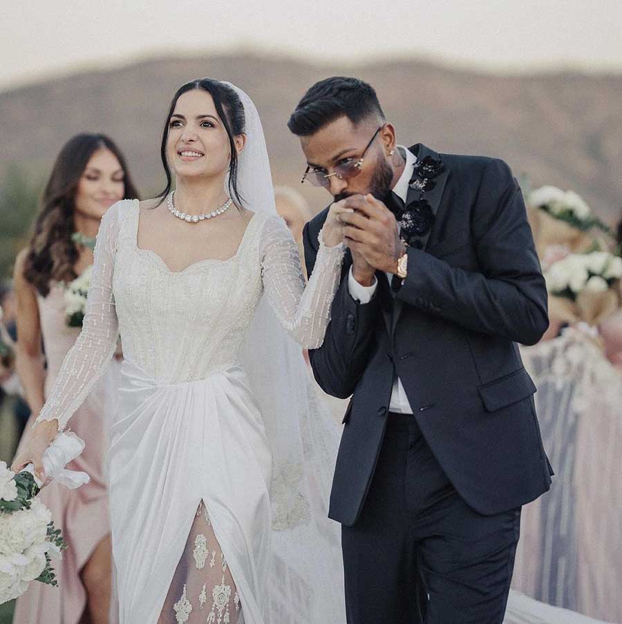 They renewed their vows in a white wedding ceremony first. Natasa wore a corset top gown with lace work all over it. 