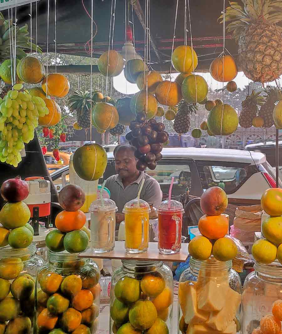 With the temperature soaring, people are seen enjoying fresh fruit juice at a stall in Kolkata on Friday. The erratic weather is also triggering viral infections  