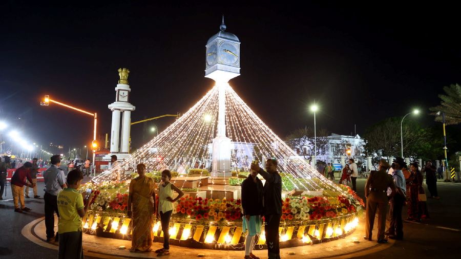 People gather at the Marina beach to celebrate the New Year 2023, in Chennai. 