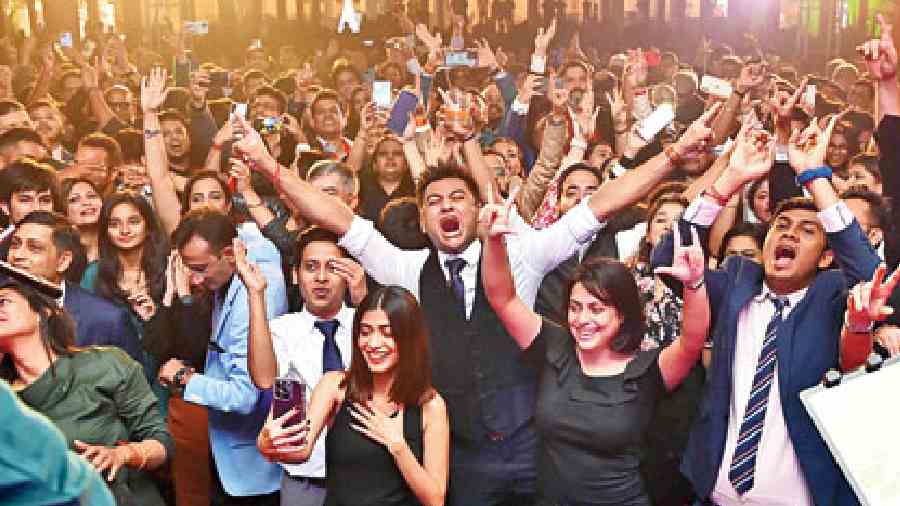 The crowd on the dance floor went wild with joy as the clock struck 12, raising their arms in the air to celebrate the moment while others connected with loved ones far away over video calls.