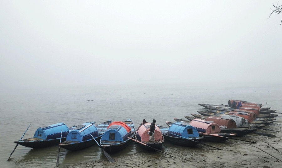 Boats docked at a mist-covered Babughat on Wednesday morning. Kolkata has experienced a dip in mercury since Tuesday as a thick blanket of fog and strong northwesterly winds brought down the temperature