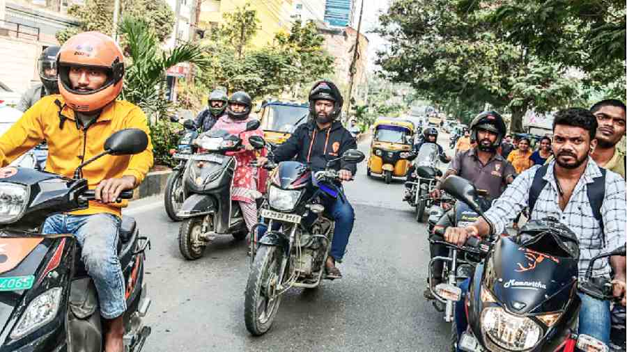 Shivam Tirupati Niralwar (centre) riding to a delivery destination in Hyderabad