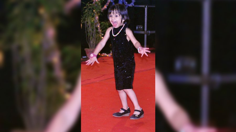 Decked out in a shimmering party dress, matching shoes and the cutest of accessories, this tiny tot truly knew how to rock the party with her spontaneous dance movies.