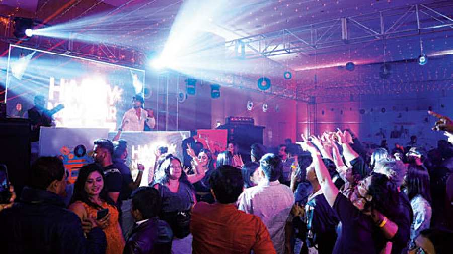 The euphoric crowd at the Novotel rooftop erupted in unison the moment the giant screen lit up with the words Happy New Year.