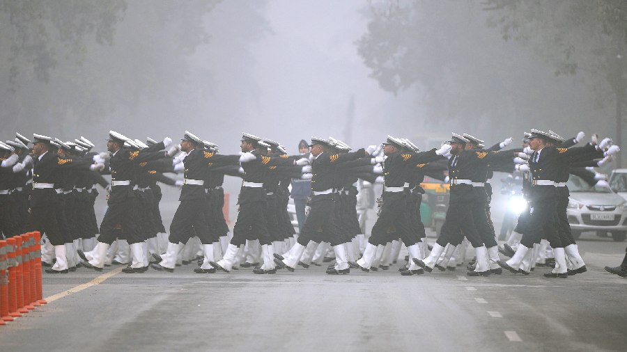 An Indian Coast Guard contingent rehearses for the Republic Parade 2023 at the Kartavya Path during a cold and foggy morning. 