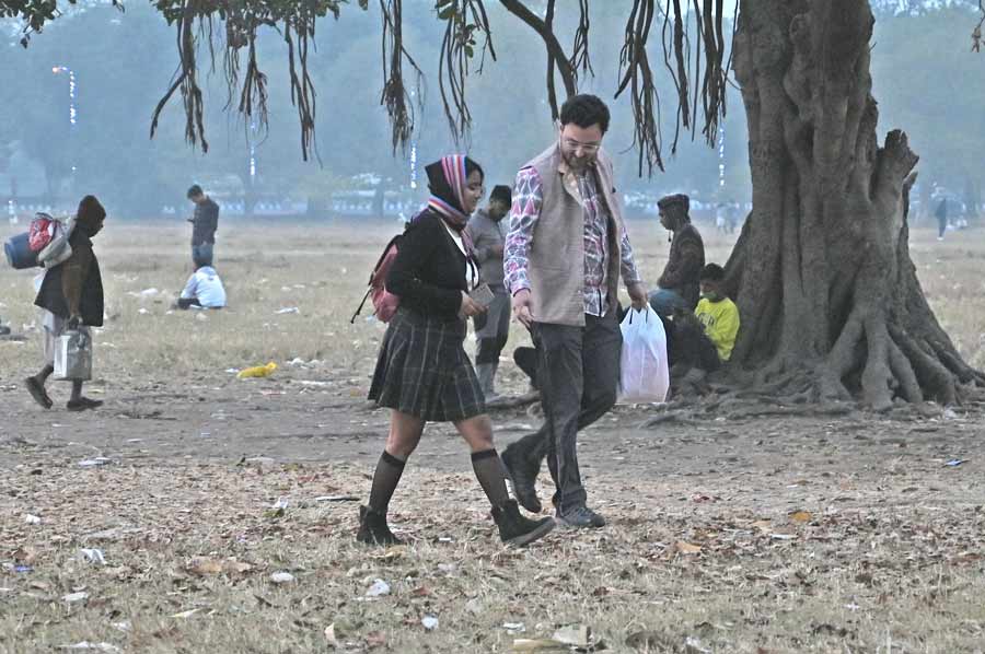 Wrapped in woollens, people walk around the Maidan as Kolkata recorded 10.5 degrees Celsius on Friday which was three degrees below normal. Howrah shivered at 9.5 degrees Celsius  