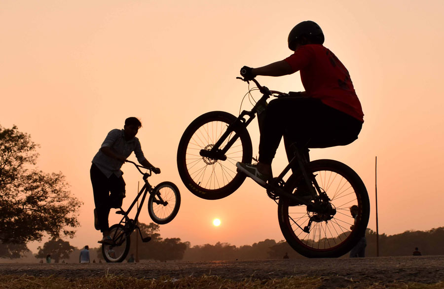 Boys perform cycle stunts at Park Street and Maidan on Friday  