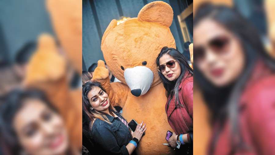 Teddy dancing and snapping photographs at a club, unusual right? The Telegraph spotted these ladies taking pictures with this adorable teddy bear! We absolutely love!