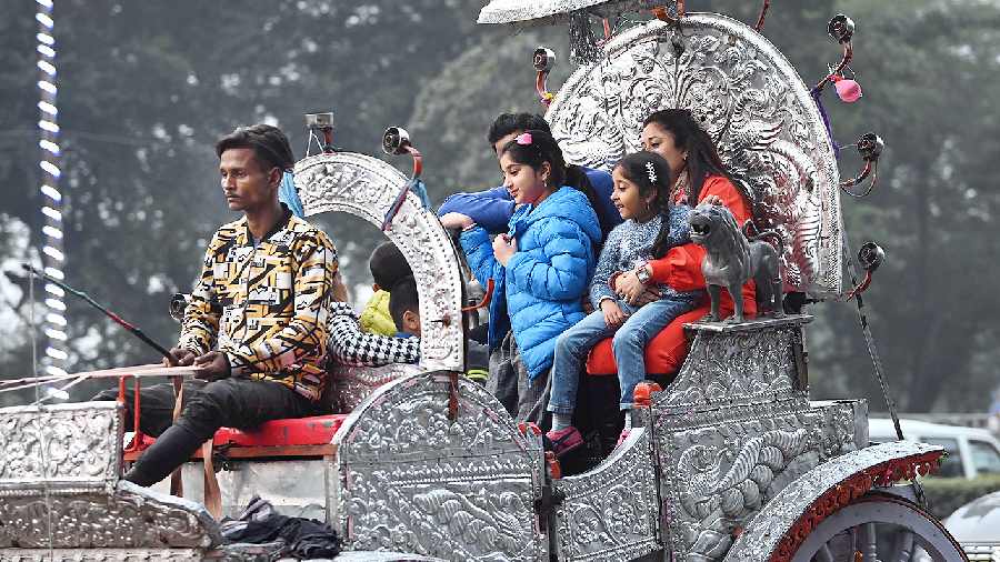 Children enjoy a horse carriage ride in the Maidan area on Thursday afternoon