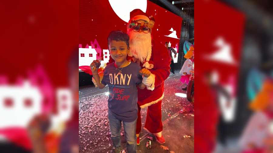 This little guy was thrilled to get a gift from Santa Claus and pose with him