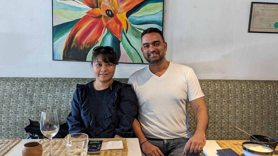 Avinash with his wife Tiz in front of one of his artworks in Cavatina