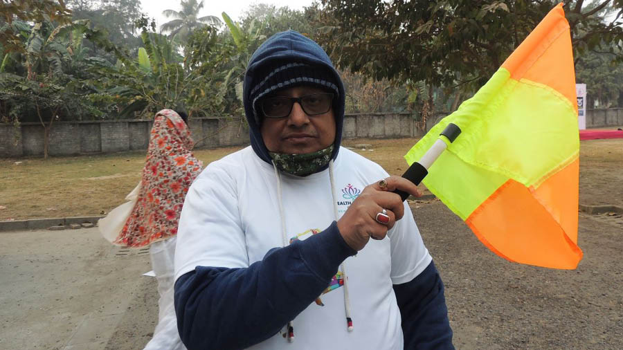 School teacher Anindya Biswas flags off the runners