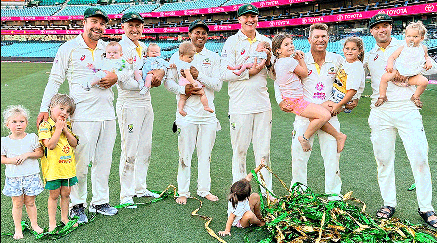 Australia players with their children at the SCG on Sunday. 