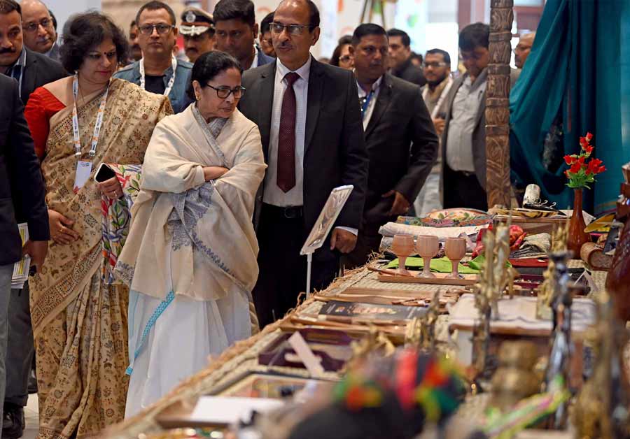 Mamata Banerjee checks out various artefacts on display at the event