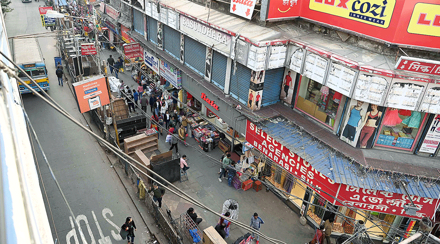 Plastic sheets removed from hawkers’ stalls on a stretch of Gariahat on Monday.