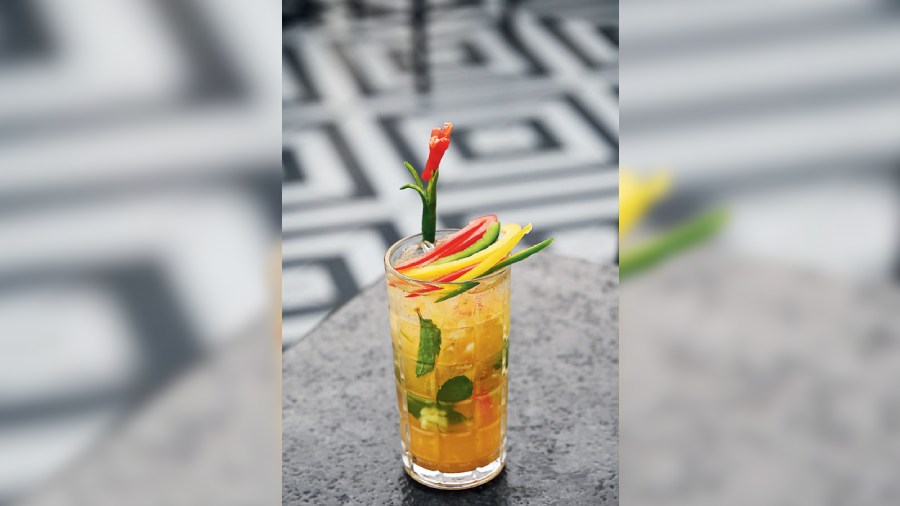 This Jamaican Mojito is for those who love a bit of chilli. White rum, fresh pineapple, bell pepper and masala creates magic with every sip.