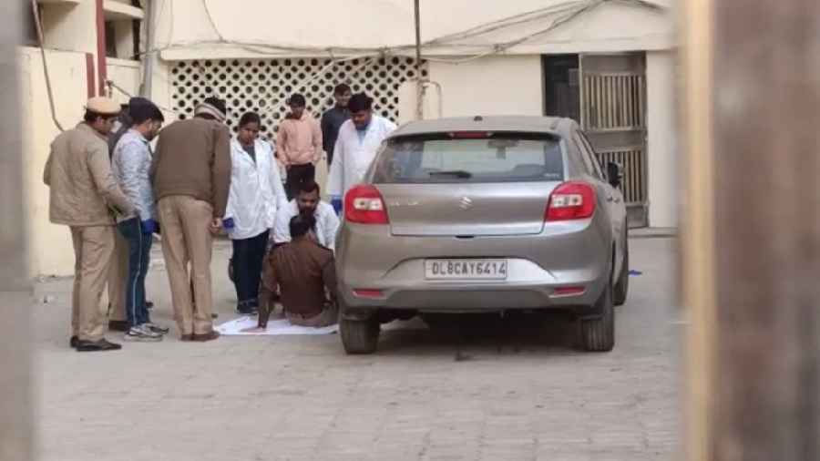 FSL team inspects the car that reportedly hit a woman and dragged her for a few kilometres which left the woman dead, during the investigation, in Delhi