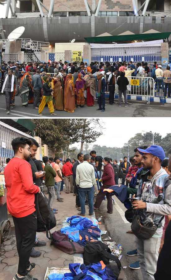 Cricket fans flock the ticket counters at Eden Gardens where India-Sri Lanka ODI is scheduled to take place on Thursday, January 12. (Bottom) People sell jackets and caps in front of the stadium