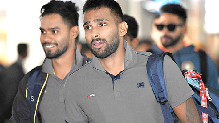 Sri Lanka’s Dhananjaya de Silva and (right) Chamika Karunaratne at Calcutta airport on Wednesday