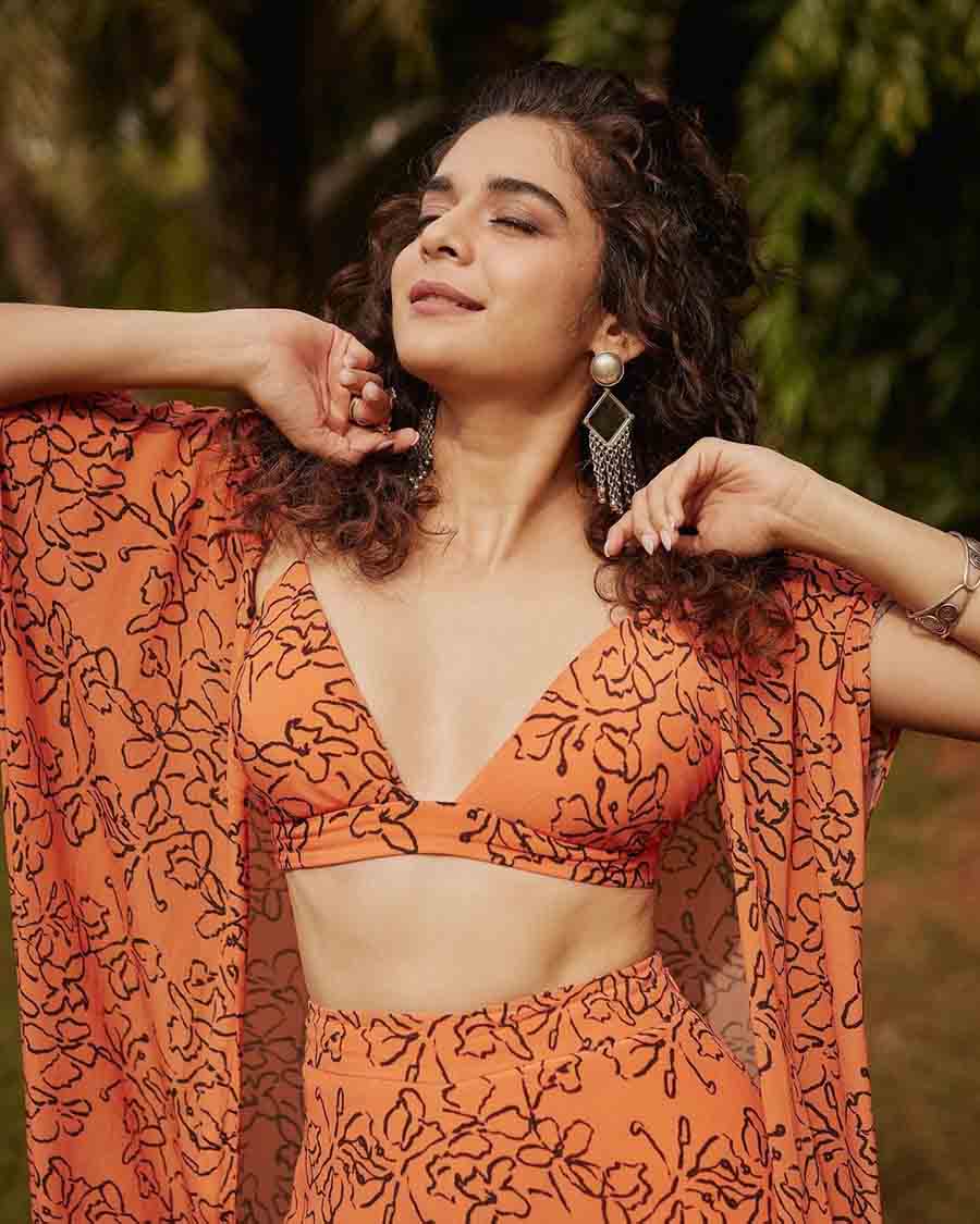 Taking a break from Indian wear, Mithila opted for an indo-western palazzo and crop top set paired with a matching shrug and stylish earrings. 