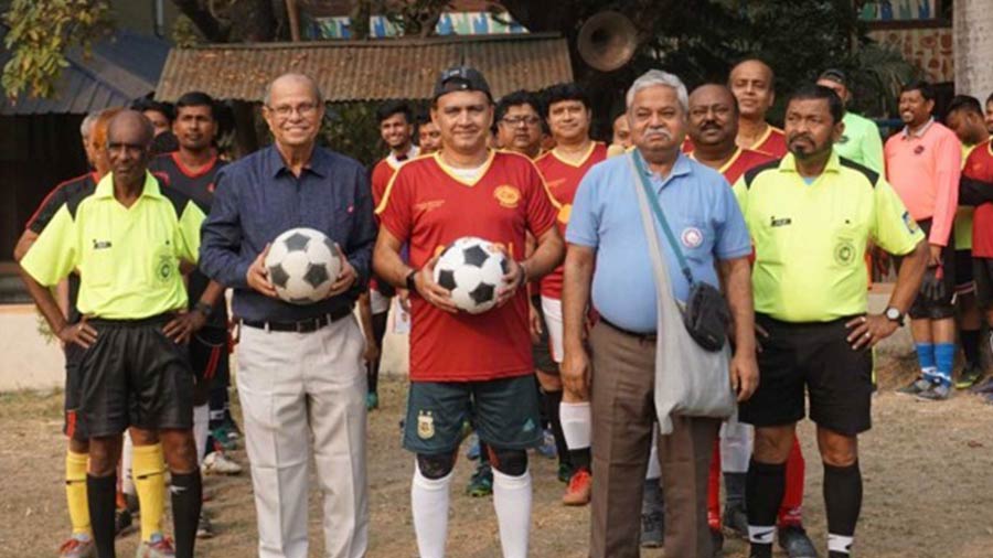 Players and match officials ahead of the football match between BGHS alumni association and Murshidabad Nawab Bahadur Institution on December 18