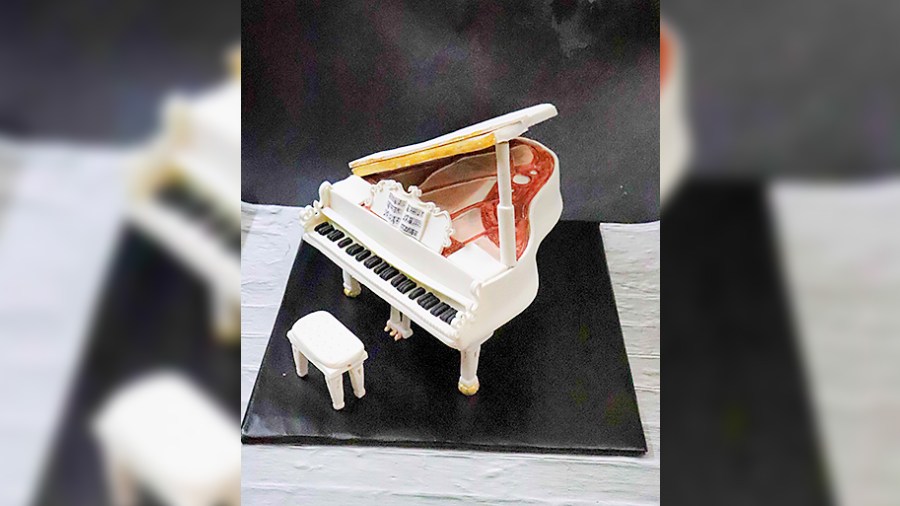 Piano: With a thorough design that highlights even the musical notes in the lyric book, this piano cake is gorgeously made and is perfect for any occasion.
