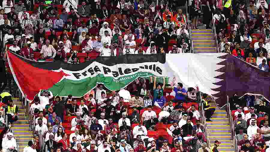 GAME POINT: Spectators hold up a ‘Free Palestine’ banner during a match in Qatar.