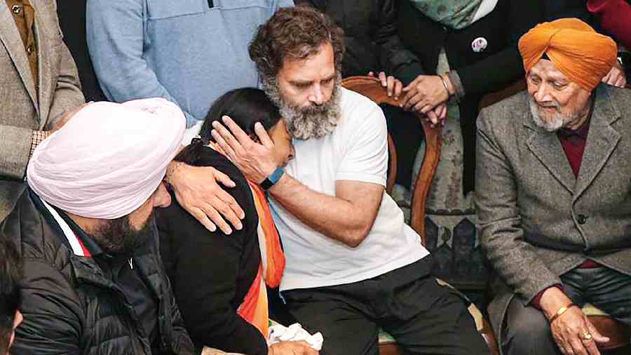 Rahul Gandhi consoles a family member of MP Santokh Singh Chaudhary, who died during the Yatra, in Jalandhar on Saturday.