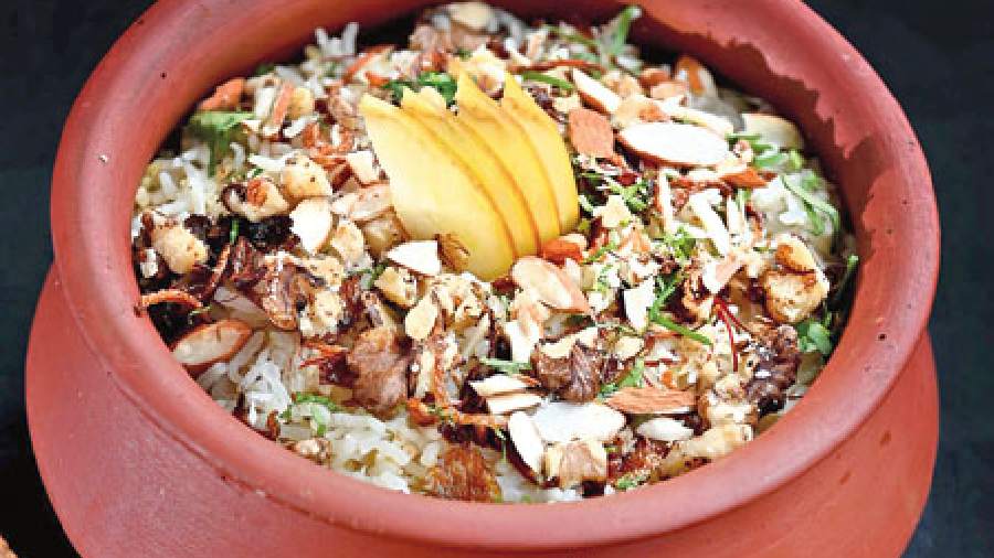 Veg Kashmiri Pulao: The aromatic waft of saffron and spices rule this pulao. Topped with fennel, caraway seeds, dry fruits and apples, you’ll love digging into this rich rice preparation.