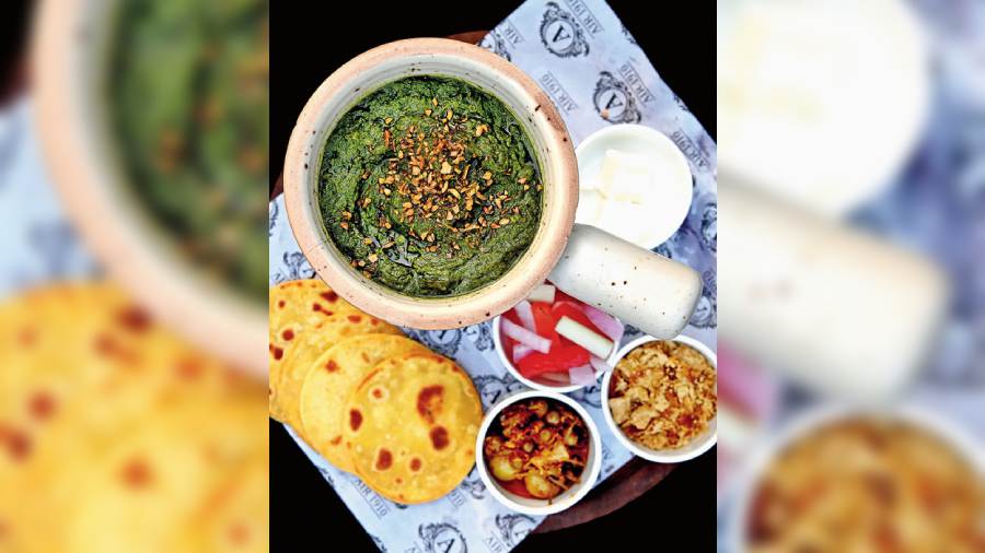 Sarson ka Saag and Makki ki Roti: Taking you back to the Pind is this comforting plate of mini makki rotis with hot and fragrant sarson ka saag. The pickle and jaggery add to the flavour profile of the dish.