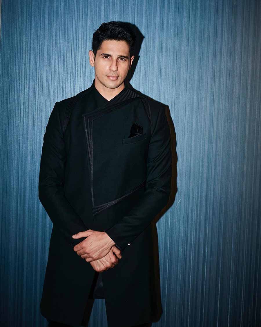 The actor looked stunning in a black suit with panelling designed by Gaurav Gupta. 