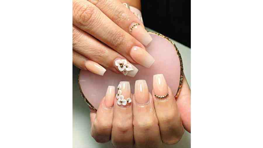 3D NAILS: Nail trends are all over this season. From airbrush to chrome, it is definitely about going creative this year. 2023 nails are all about playing around with textures and dimensions, from thick accents to replicating reality.