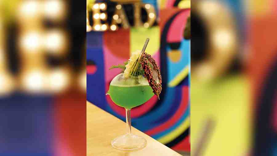 Khus and Cilantro is made with khus syrup and muddled cilantro, and served in a bird-shaped glass.