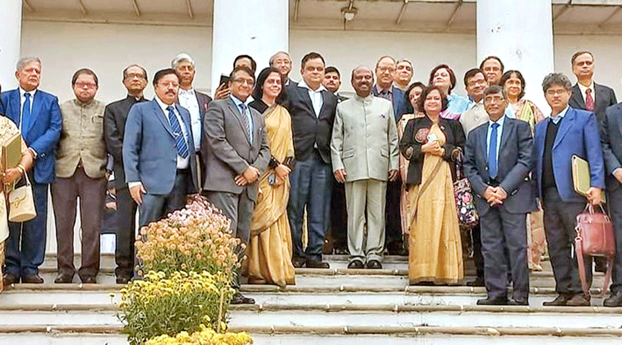 Governor C.V. Ananda Bose and education minister Bratya Basu with vice-chancellors of state universities after the meeting on Tuesday.