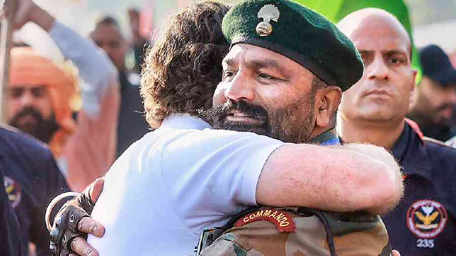 Rahul Gandhi hugs a commando at the Bharat Jodo Yatra in Hoshiarpur district on Tuesday.