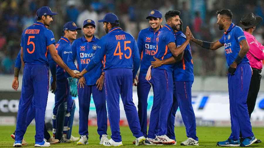 India's Mohammed Siraj celebrates with teammates the dismissal of New Zealand's captain Tom Latham during the first ODI cricket match between India and New Zealand, at Rajiv Gandhi International Cricket Stadium, in Hyderabad