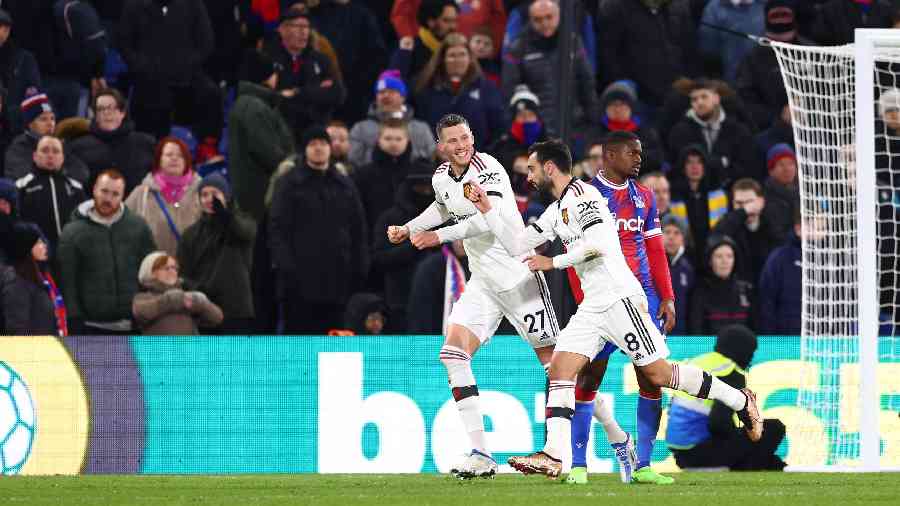 Manchester United players celebrate after scoring the opening goal against Crystal Palace, on Thursday.