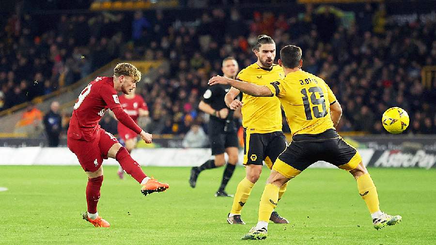 Liverpool’s Harvey Elliott (left) scores against Wolves during the FA Cup third round replay game at the Molineux Stadium in Wolverhampton on Tuesday