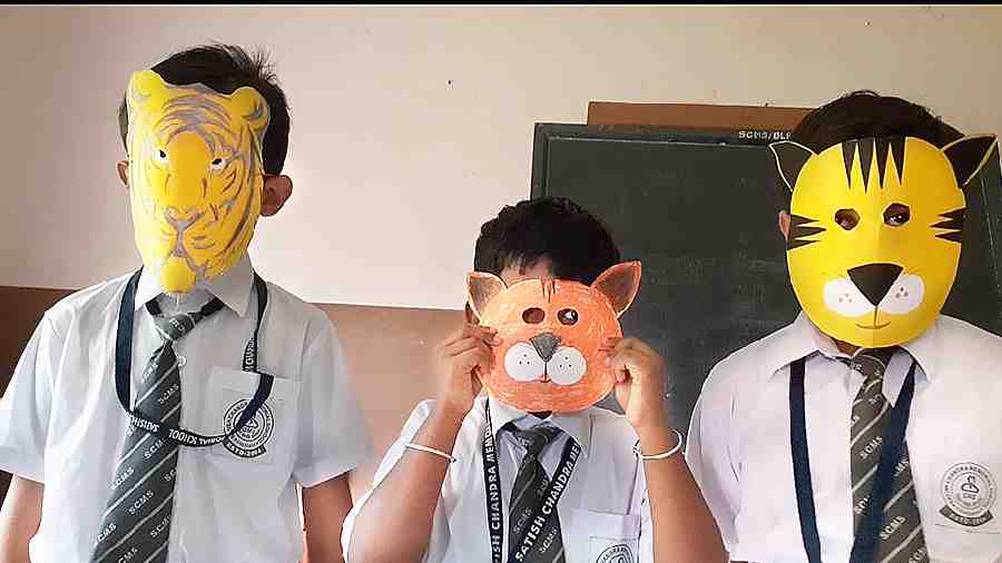 Students of Satish Chandra Memorial School display their handmade masks